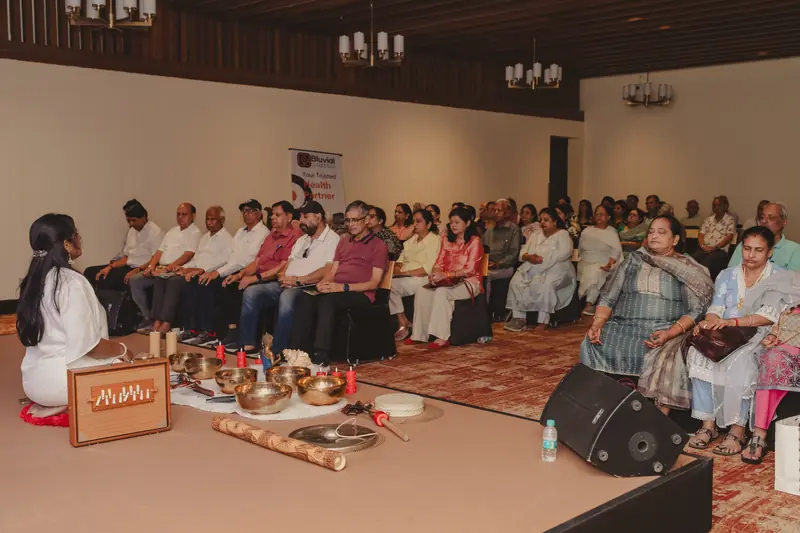 Senior citizens participating in a sound healing session