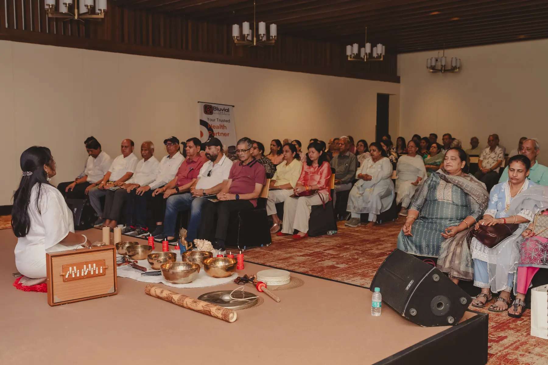 Senior citizens participating in a sound healing session
