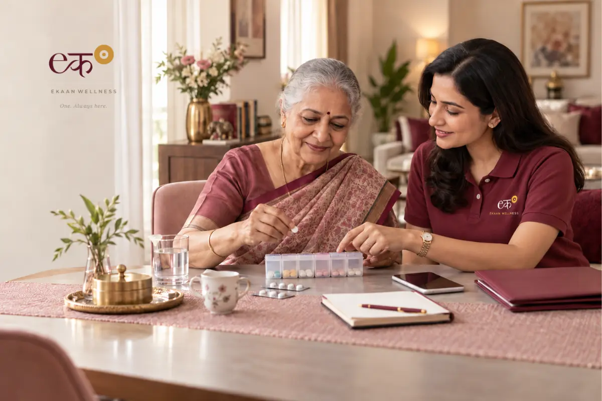 An older woman and an Ekaan Wellness Care Manager reviewing a pill organiser at home.